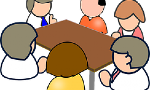 Stilisierte Menschen an einem Tisch